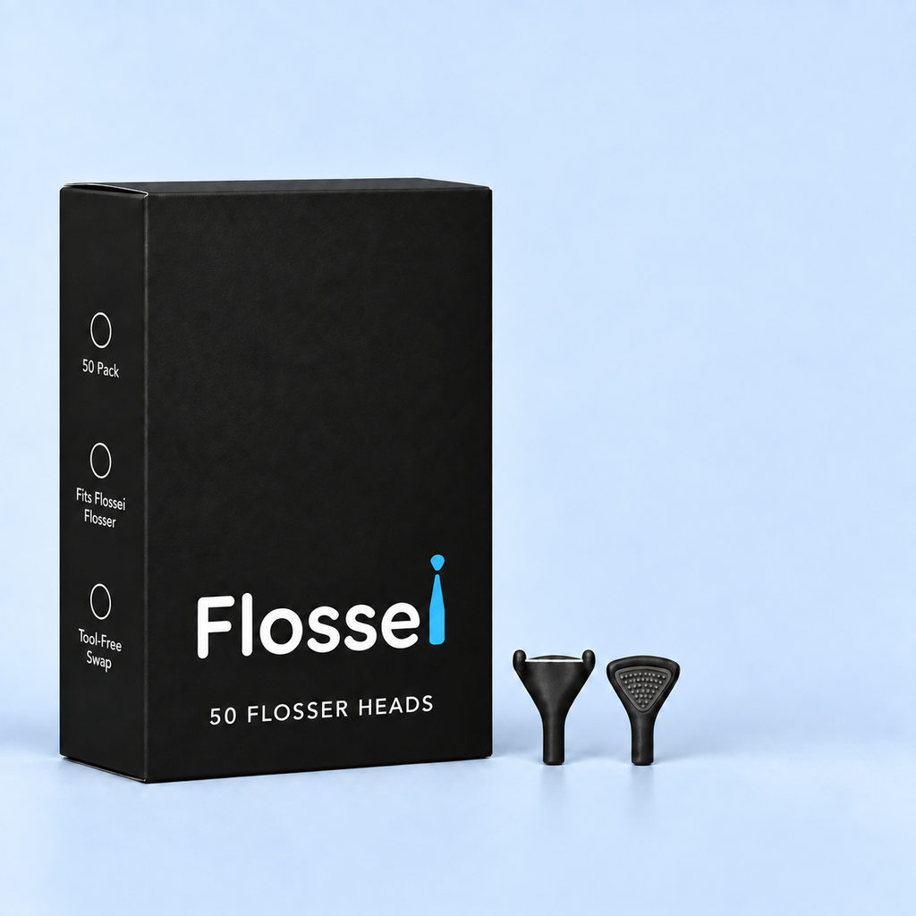 Box of 50 Flossei reusable floss heads in Midnight Black with two floss heads shown beside it